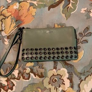 Coach wristlet with grommets